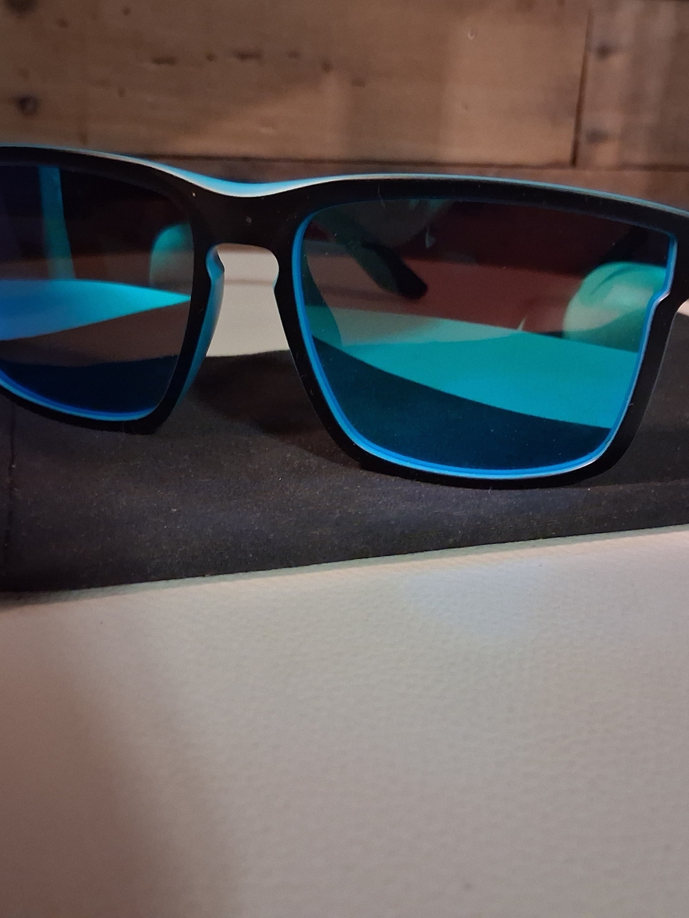 Stylish Black Sunglasses with Blue Mirrored Lenses